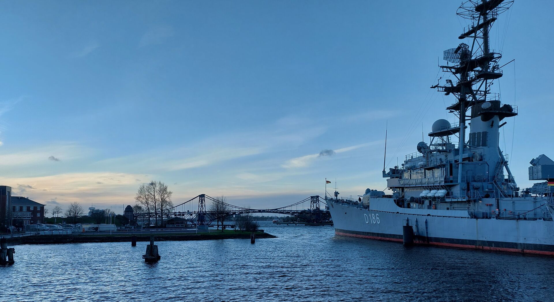 Picture of a navy ship in front of a bridge in Germany