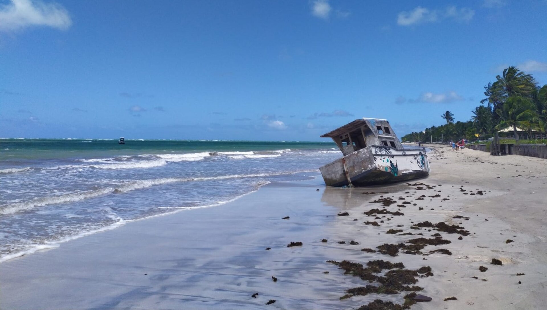 Picture of a stranded boat on a beach in Brazil